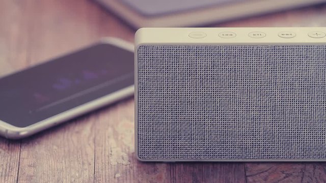 Portable speaker with a generic modern smartphone or cellphone	