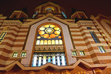 A fragment of the central facade of the New Liberal Synagogue with evening lighting. Kaliningrad - 340709427