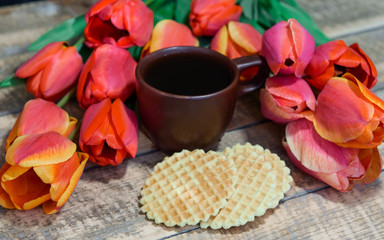 Coffee on a wooden table. Waffles are round. Breakfast