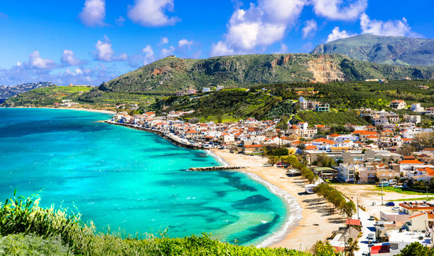 High resolution aerial panorama of Kalyves beach and Souda Bay, Chania region, Crete, Greece. Turquoise sea water and coastal village landscape.