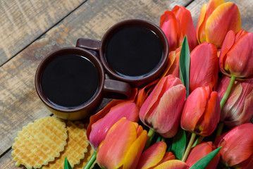 cup of coffee with tulips