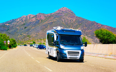 Rv cavaran on road in on Sardinia reflex
