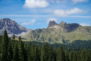 Fototapeta na wymiar Alpe di Siusi, Seiser Alm and Forcella Denti di Terrarossa in the Dolomites. Beautiful place for hiking. Distincive mountains in South Tyrol, Italy.