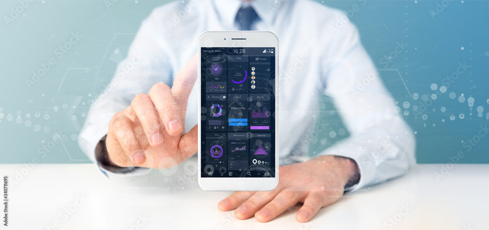 Poster businessman holding smartphone with user interface data on the screen isolated on a background