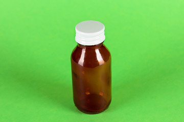 red glass medicine bottle upside view