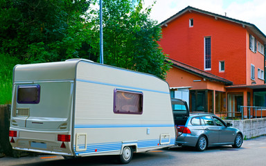 Car with Caravan in road Switzerland reflex