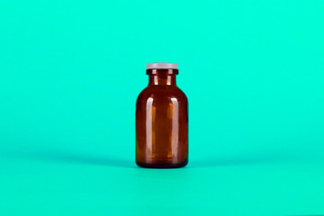 Medicine glass bottle with red capsules
