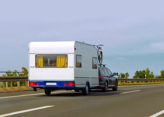 Caravan on road of Switzerland reflex