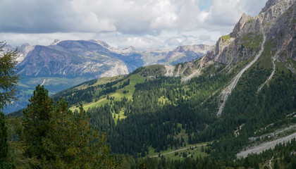 Fototapeta na wymiar Panoramic view: Stunning view into the wide and open landscape of Alp de Siusi - Mont Seuc. Gardena Valley, South Tyrol, Italy, Europe.