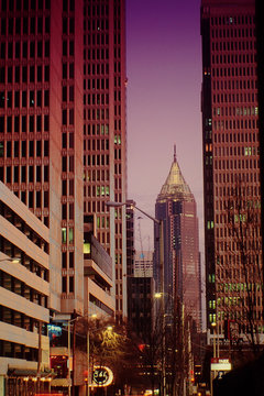 Bank Of America Plaza Amidst Buildings In City Against Clear Sky At Dusk