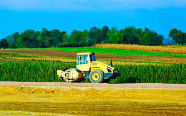 Fototapeta premium Road roller on road reflex