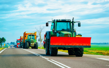 Agricultural tractor in highway road Poland reflex