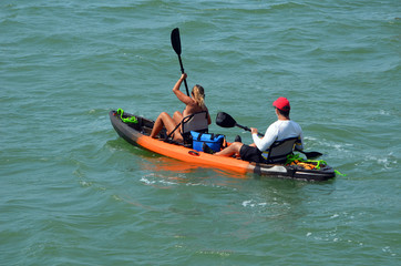 Man and a woman kayaking on the Florida Intra-Coastal Waterway off Miami Beach.