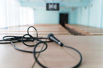microphone on a table in an empty classroom for lectures