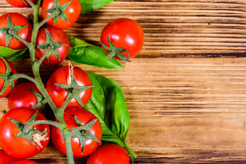 Heap of small cherry tomatoes on wooden table. Top view