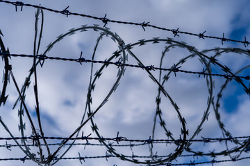 Prison barbed wire. Prison fence. Strict punishment for crimes