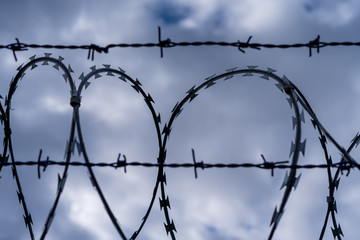 Prison barbed wire. Prison fence. Strict punishment for crimes