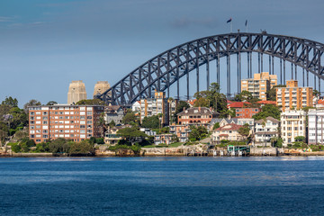 Sydney, Australia - 10th February 2020: A German photographer visiting Sydney in Australia, taking pictures of the skyline with the Harbour Bridge during a cloudy but warm day in summer.