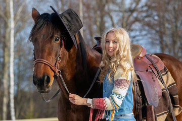 Obraz premium Pretty blondy women with the horse