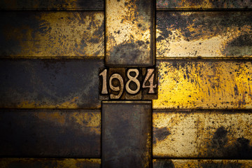 Photo of real authentic typeset numbers forming 1984
on vintage textured grunge copper background