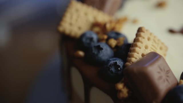 Cake with three layers of different taste, different types of chocolate. Garnished with berries, cookies and chocolate-2.