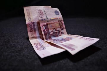 money on a black background