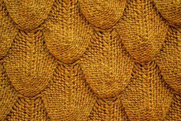 Realistic knitted texture closeup in orange brown,ocher color . Background template for the design...