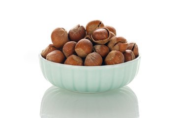 Hazelnut nuts on a white board