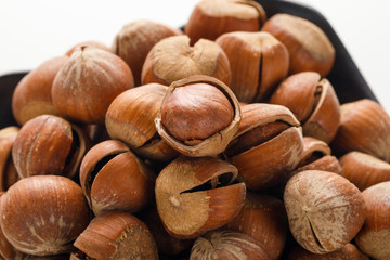 Hazelnut nuts on a white board