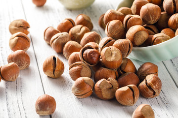 Hazelnut nuts on a white board