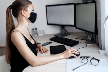 COVID-19 Pandemic Coronavirus Mask Woman Home Working Isolation Laptop Computer Auto Quarantine. Girl wearing face mask smart home working on a home computer against Coronavirus Disease 2019.Complianc