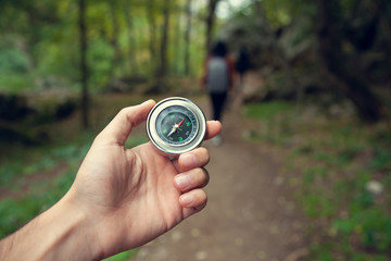 man hand compass