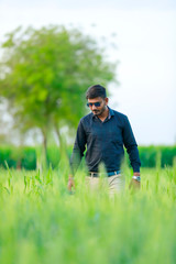 young indian banker at field