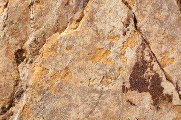 yellow stone background with abstract shapes