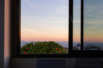 Nice sunset seen through a large open home window