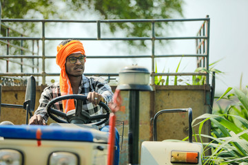 Fototapeta premium indian farmer with tractor at field