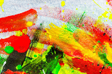 Bright juicy oil paints on denim. Bright fabric background. Abstract oil painting on cotton.