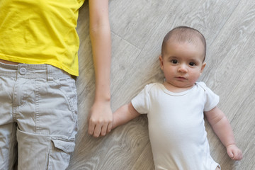 Newborn baby with brother. Brothers. Summer time. Friends. love and friendship.