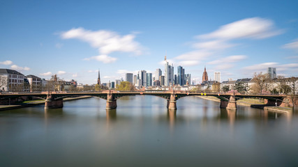 Obraz na płótnie Canvas Frankfurt, Germany - March 31, 2020: frankfurt skyline view with ignas bubis bridge during daytime