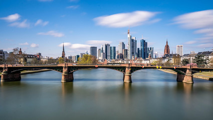 Fototapeta premium Frankfurt, Germany - March 31, 2020: frankfurt skyline view with ignas bubis bridge during daytime