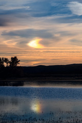 Sunrise sun-bow over the lake in New Mexico