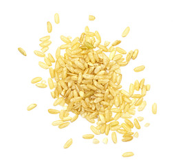 a pile of brown rice isolated on a white background, top view. unpolished white rice for health. culinary dish for diabetes treatment