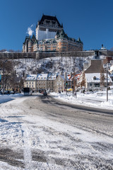 Fototapeta na wymiar Frontenac castle in Quebec city at winter time. View from the river