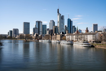 Fototapeta na wymiar Frankfurt, Germany - March 31, 2020: frankfurt skyline view from main riverside in springtime