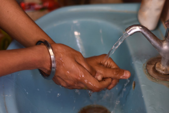 India - April 16, 2020: Boy Washing A Hand With Water And Soap, After Covid 19 Lock Down, In India