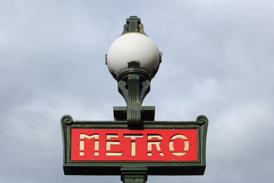 Paris, France - September 23, 2015: Vintage metro sign in Paris at subway station entrance, France