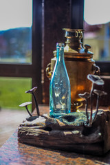 Obraz na płótnie Canvas Rustic scenery samovar and bottle