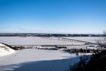 Bridge in the Saint Laurent river in Quebec, Canada. Winter time