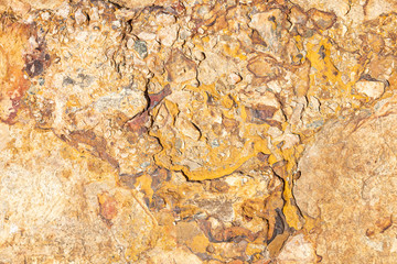 yellow stone background with curious and abstract shapes