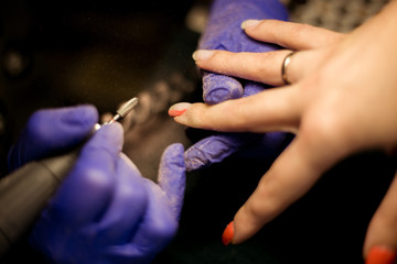 Women do manicures at home. Self-isolation manicure. Nail salon